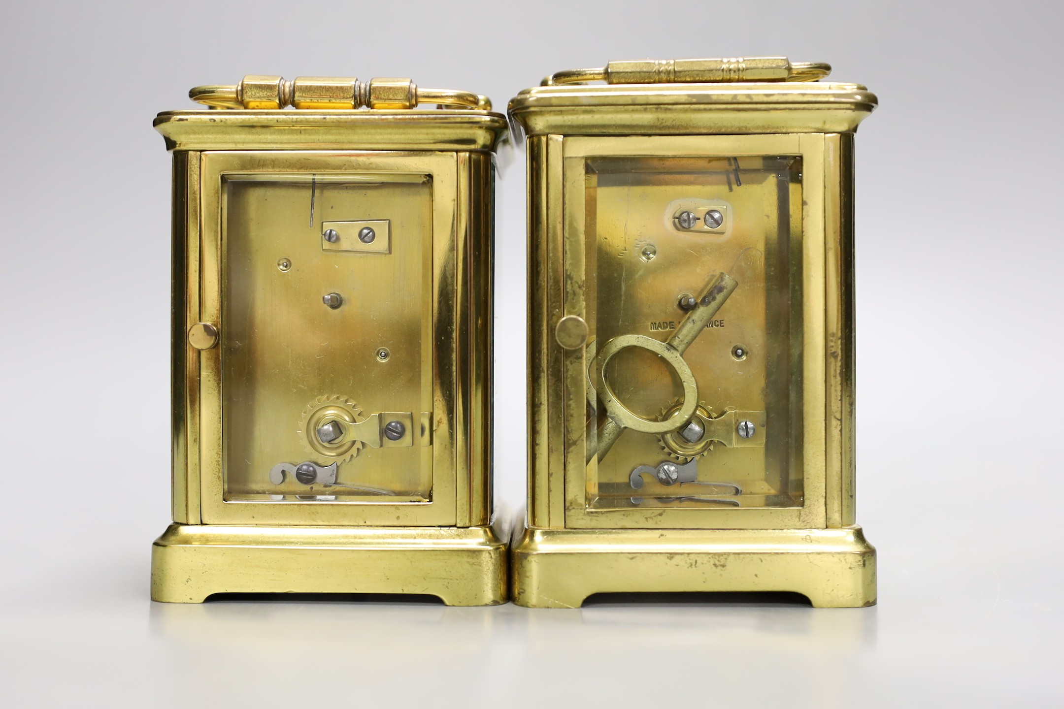 Two brass cased carriage timepieces. Tallest 12cm